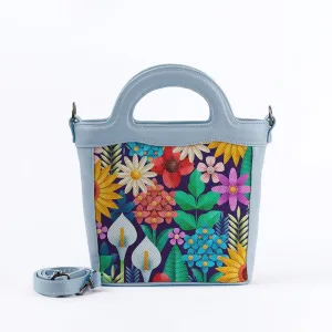 Blue Top Handle Handbag Standing Flowers